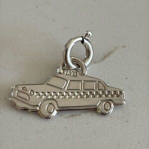 Tiffany & Co sterling silver taxi cab charm  
includes connector clasp.